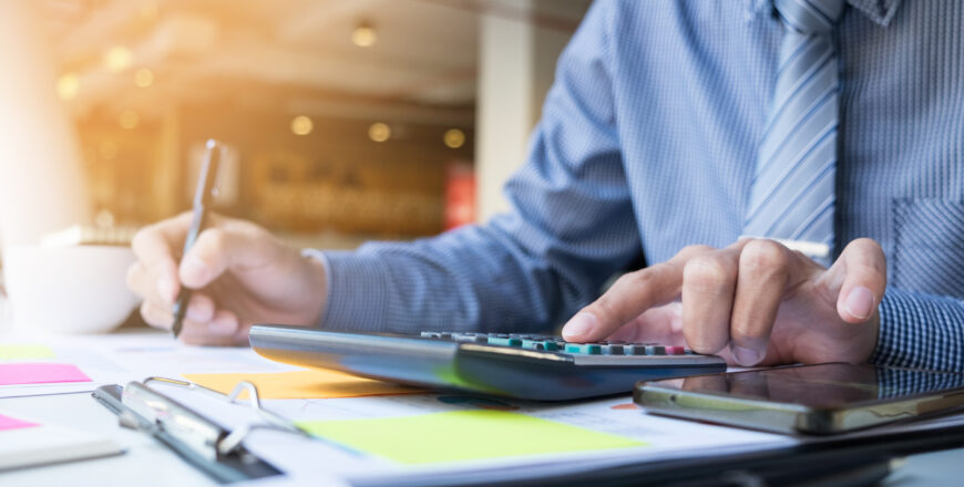 Business finance man calculating budget numbers, Invoices and fi