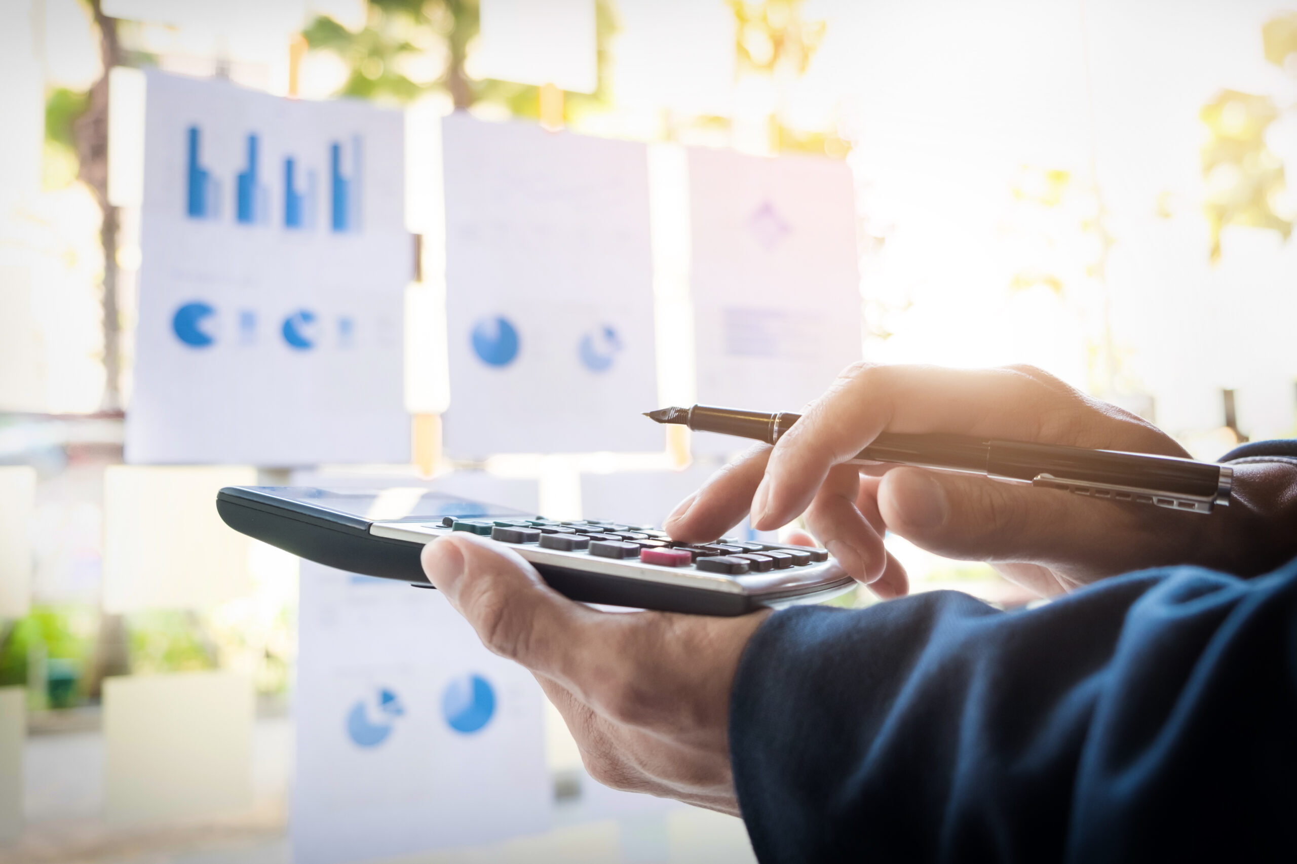 Business finance man calculating budget numbers, Invoices and fi