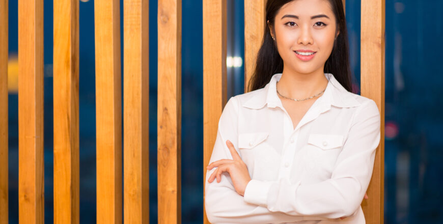 Closeup of Elegant Asian Lady at Wooden Partition