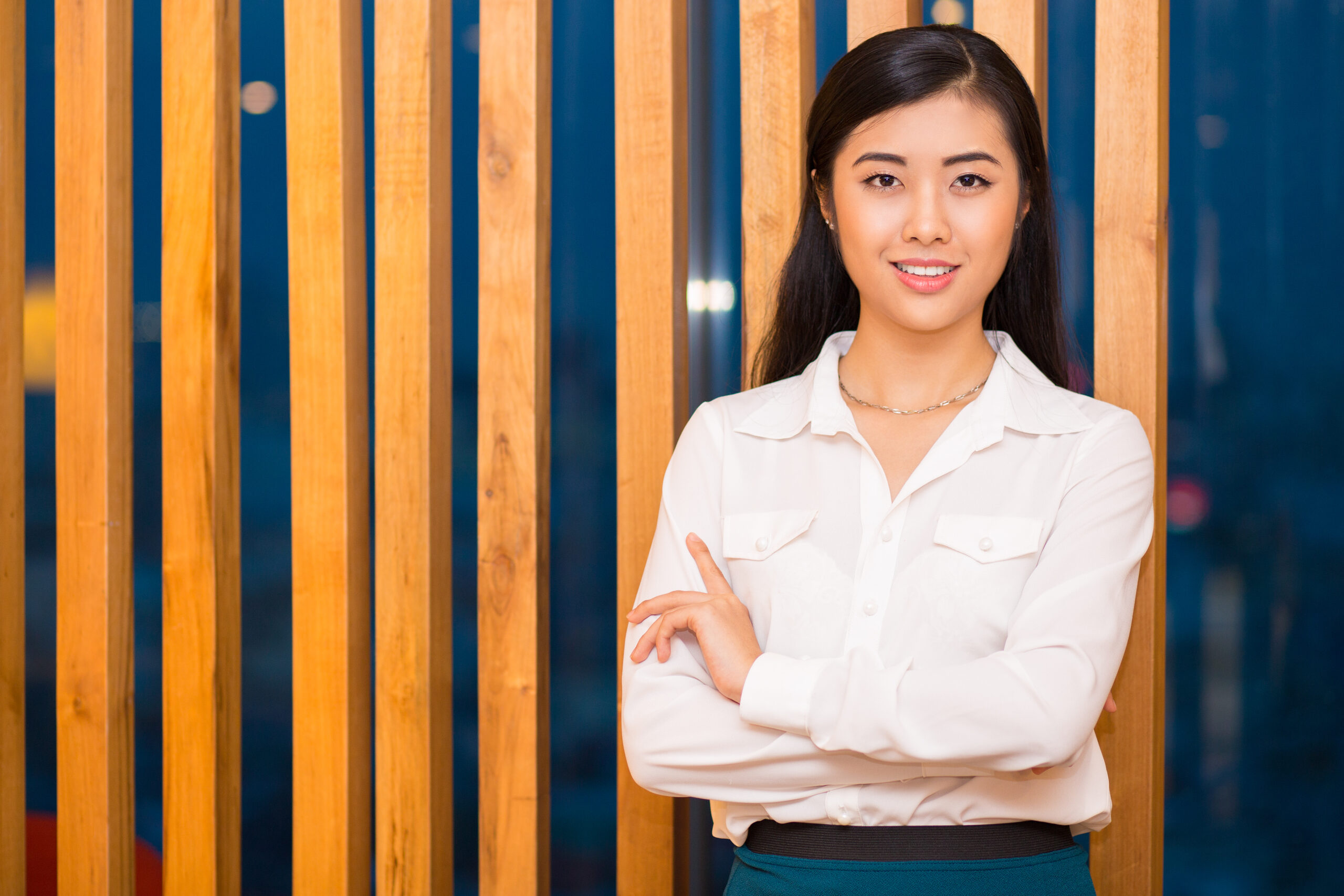 Closeup of Elegant Asian Lady at Wooden Partition