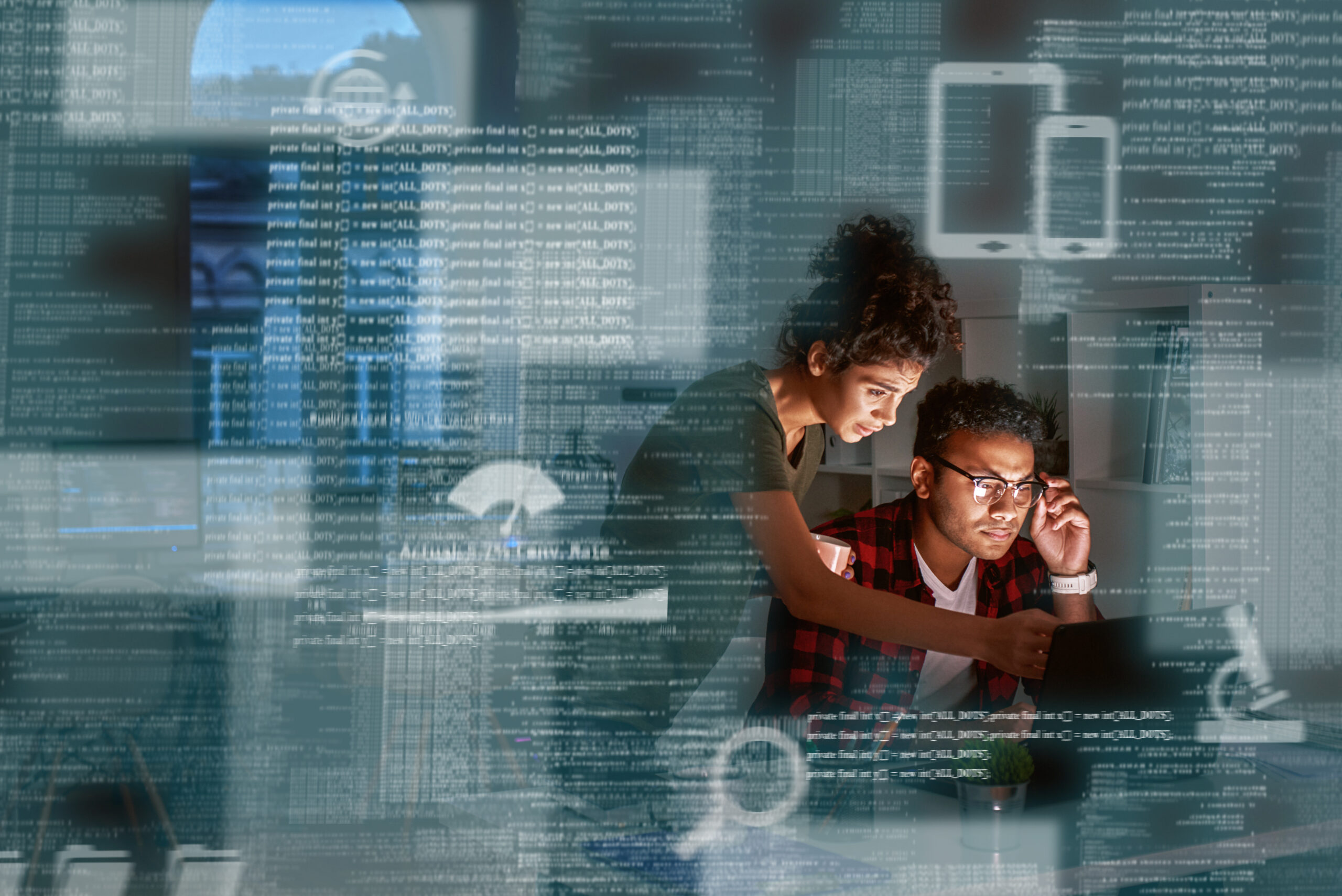 Young indian developer and his project manager discussing application code
